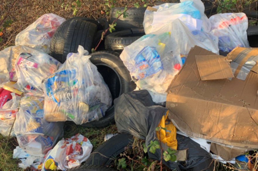 Bags of rubbish and old tyres found dumped off a lane in Spondon