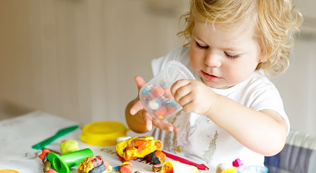 Child playing with plastacine