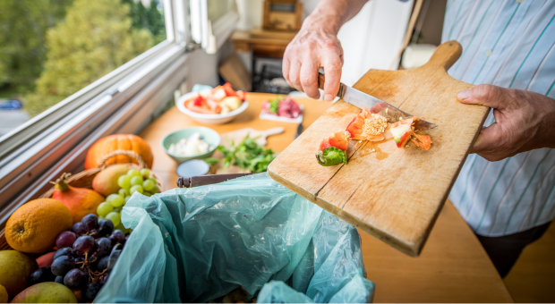 Putting vegetables in the bin