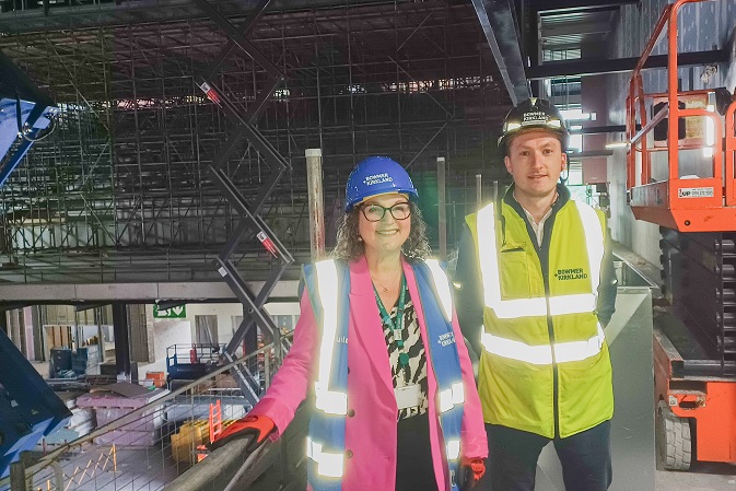 Councillor Nadine Peatfield of Derby City Council with Joshua Bredenkamp, Site Manger for B+K wearing hard hats on the site