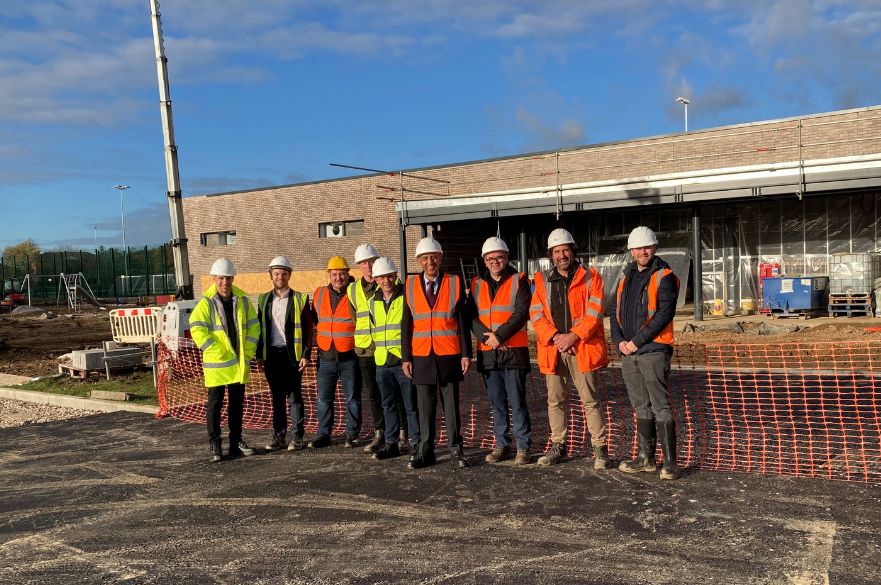 Group photo for milestone achieved at Derby Racecourse Football Hub