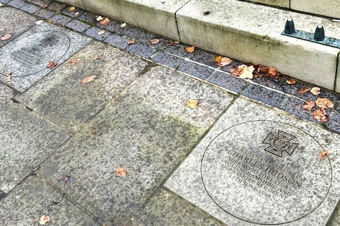 a plaque in paving stone that reads 