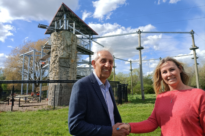 Councillor Hardyal Dhindsa shakes hands with Lianne Glendinning from Tree House Trek at the Markeaton high ropes course