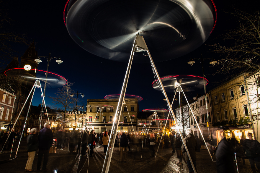 Spinning sculptures at night