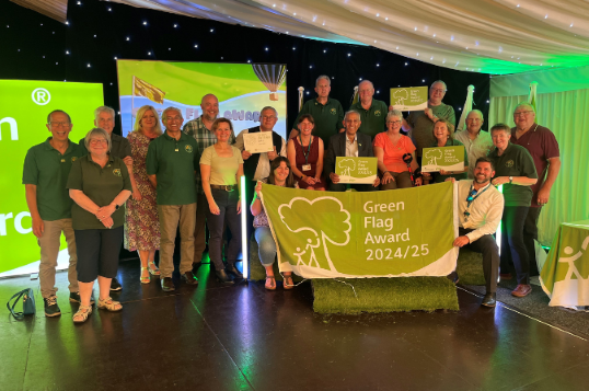 The Derby Parks team gather to receive their Green Flag Award status