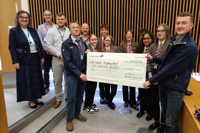 Students from the winning team in the Becketwell design competition receive their prize