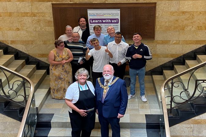 Derby's Mayor, Councillor Robin Wood, with some DALS learners at the presentation event at Council House