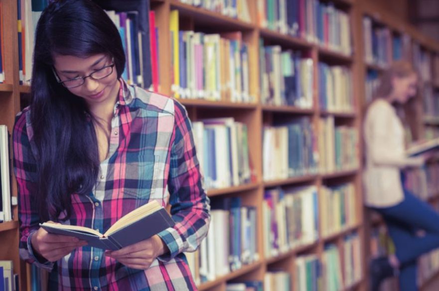 People reading books in library