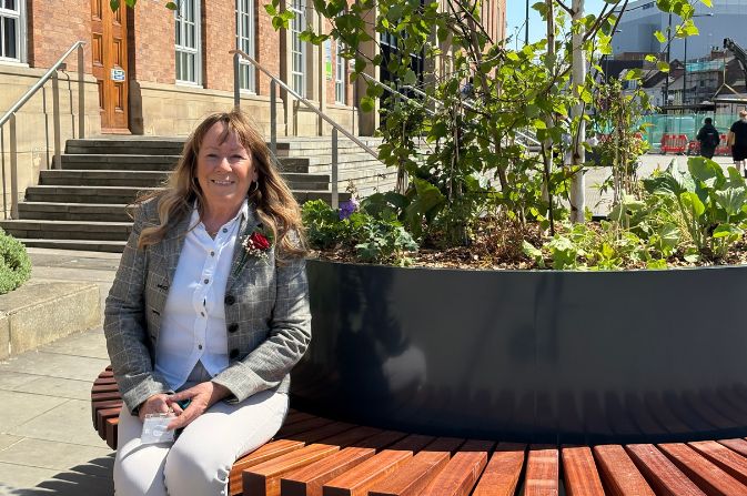 Councillor Carmel Swan with new seating area