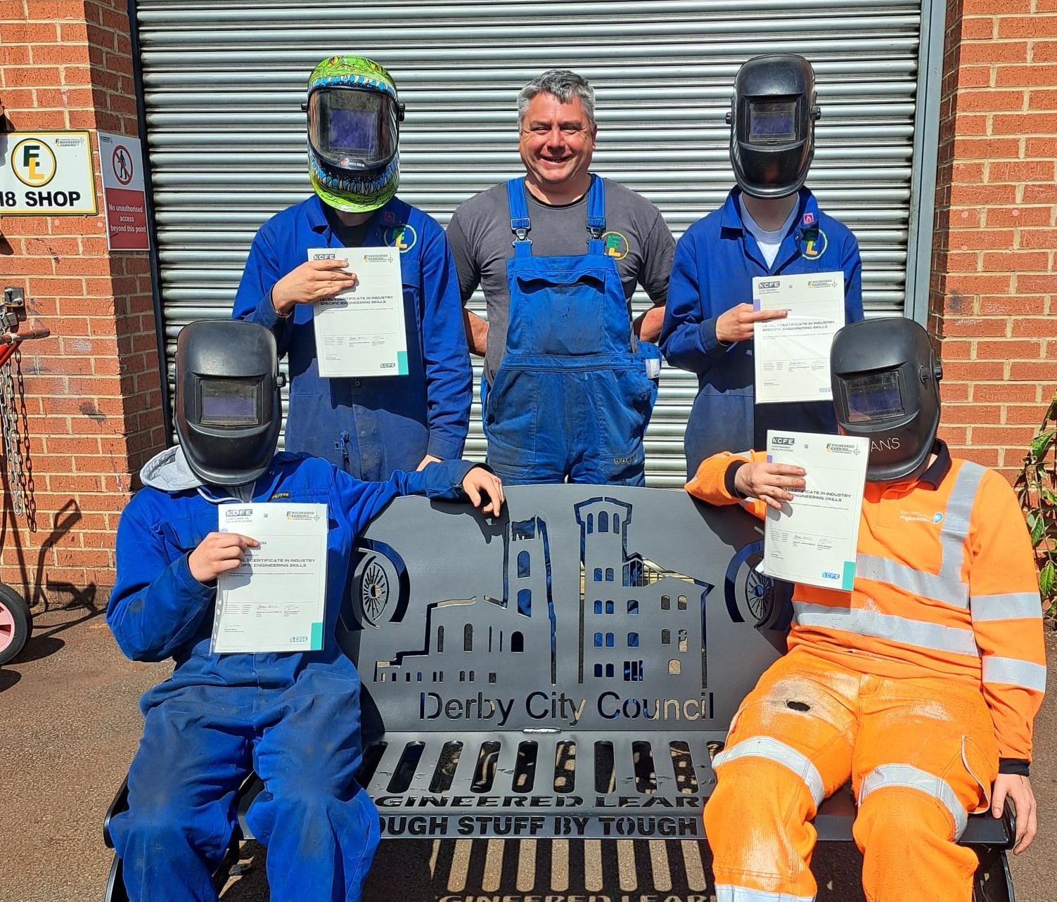 Young people at Engineered Learning with their training certificates