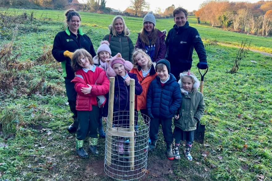 Children from Portway Infant School plant their tree