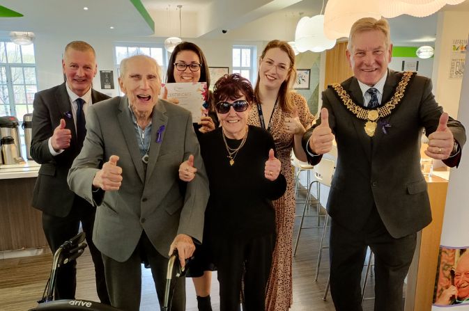 Residents and staff members from Handyside Court receive their Community Respect Award from the Mayor