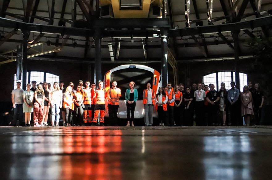 Group shot of Rail Minister Wendy Morton with young rail professionals from Derby inside the Roundhouse.