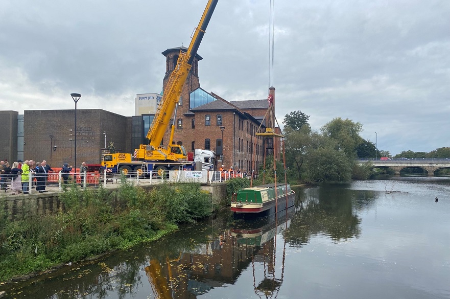 Boat being lowered into the River Derwent