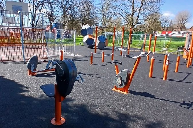 Outdoor gym equipment in a sunny park