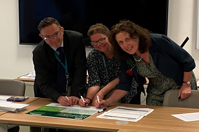 Paul Simpson, Dr Robyn Dewis and Cllr Alison Martin sign the Healthy Weight Declaration