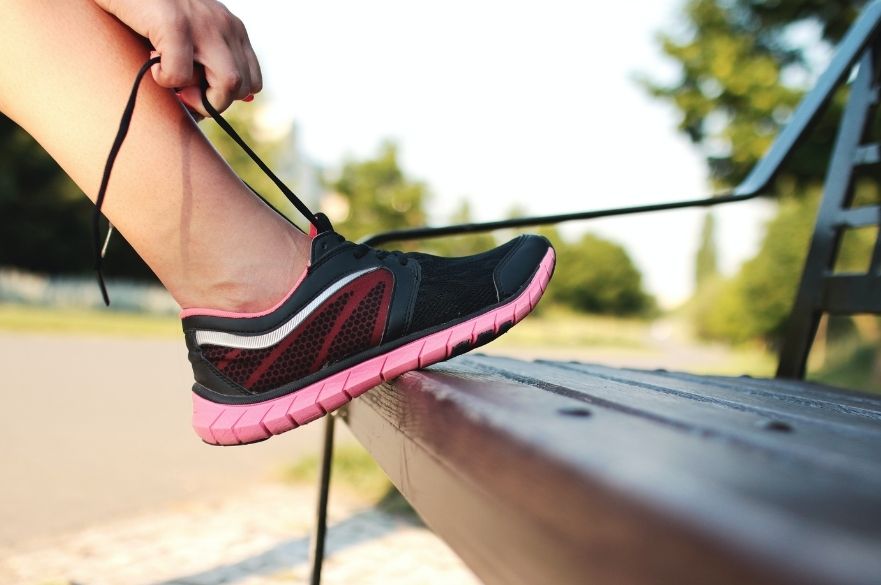 person tying trainers