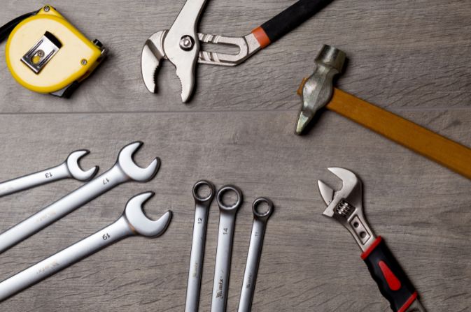 A collection of tools set out on a table