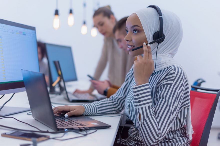 Woman with headset at a desk