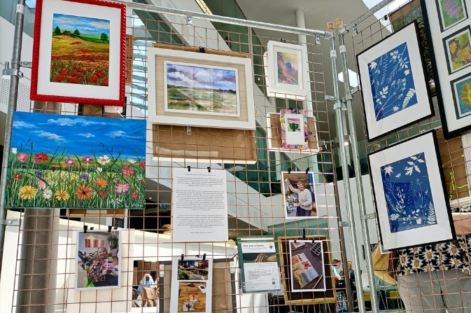 a selection of artwork displayed in an exhibition