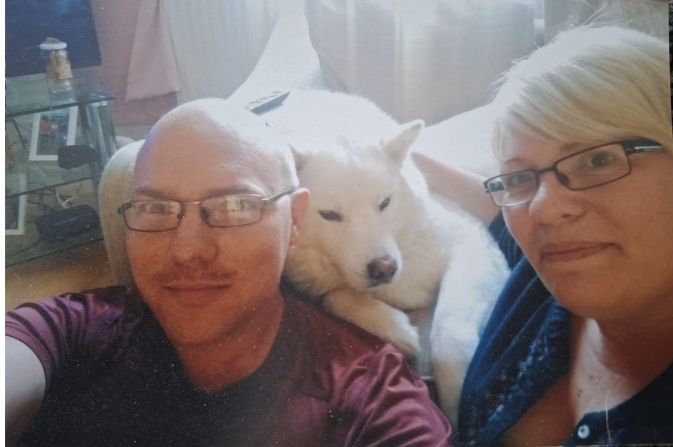 Carl with his wife and their dog, foster carers