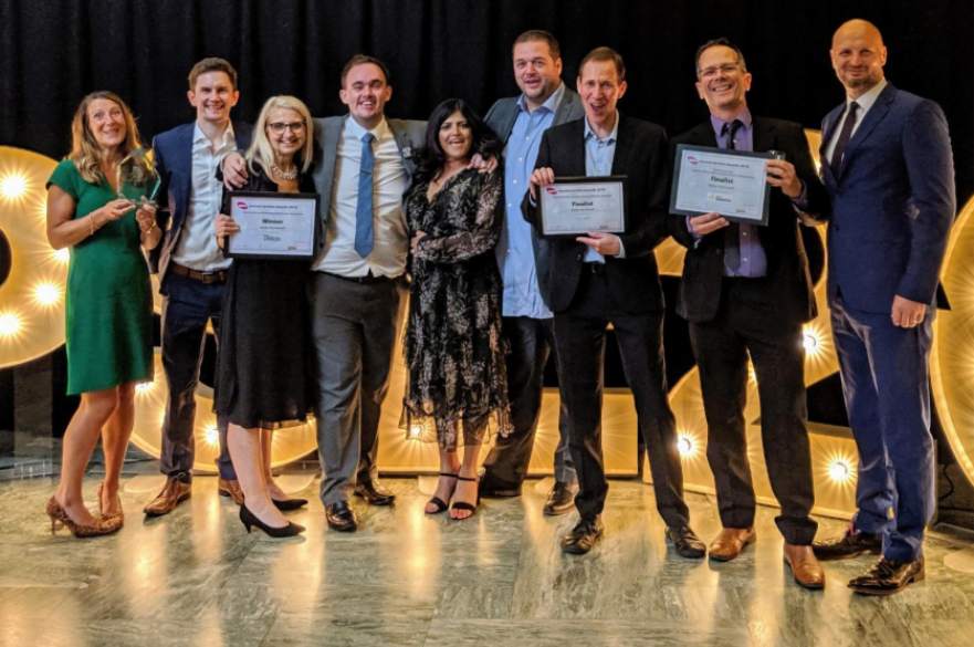 Council staff holding awards