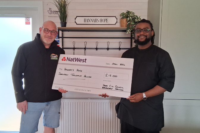 Councillor Onuoha with cheque for Hannah's Hope Charity