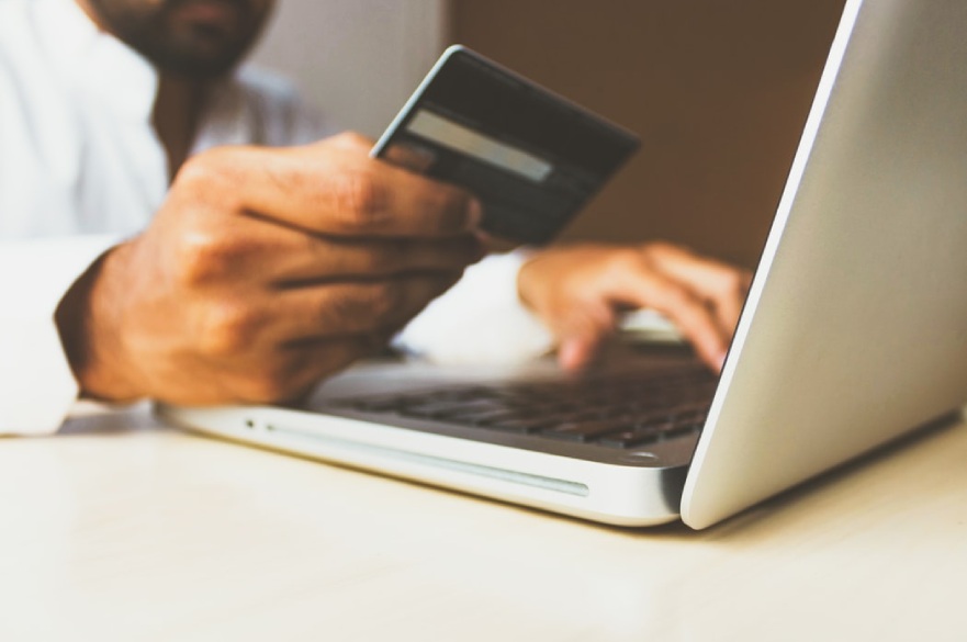 man with laptop and credit card