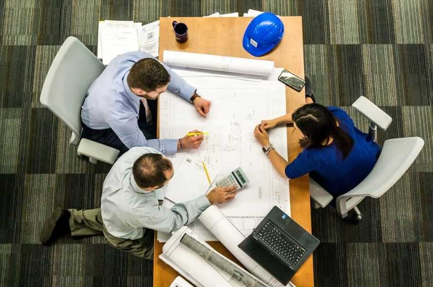 People sat around desk