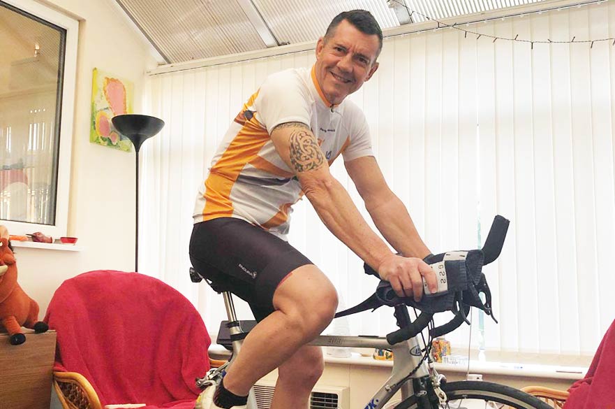 Fitness instructor on cycling machine