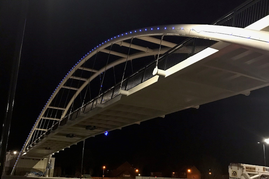 A52 footbridge lit up blue