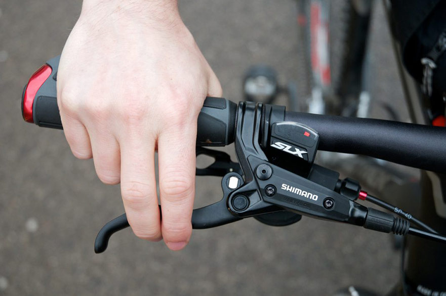 Hand on bicycle handlebar