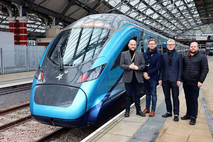 People standing next to train