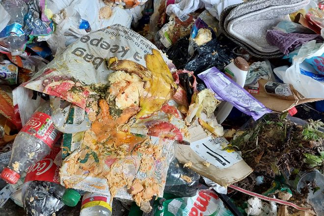 Recycling covered in food waste at transfer station